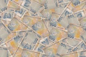 100 Turkish liras bills lies in big pile. Rich life conceptual background photo