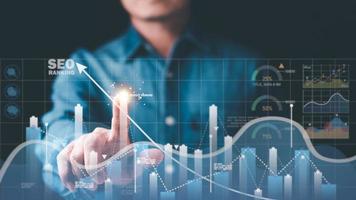Marketer pointing to graph and showing concept SEO Optimization Analyzer search engine ranking Social media sites based on results analytics data. photo