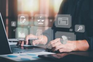 Businessman Audit documents, quality assessment management With a checklist, business document evaluation process, market data report analysis and consulting, plan review process. photo