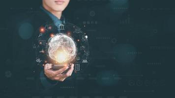 Businessman holding smartphone and virtual icons,cyberspace network connection concept,and digital communication with a large database,big data,Business analytics with modern technology photo