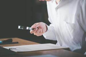 Businessman showing document review, management quality assessment with checklist, business document evaluation process, market data report analysis and consulting, plan review process photo