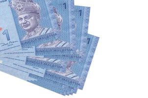 1 Malaysian ringgit bills lies in small bunch or pack isolated on white. Mockup with copy space. Business and currency exchange photo