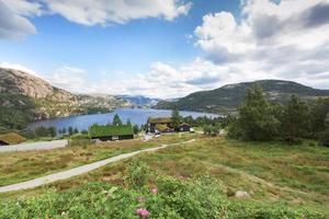 Beautiful landscape of Norway homes with green roofs and, mountainous terrain and reservoirs photo