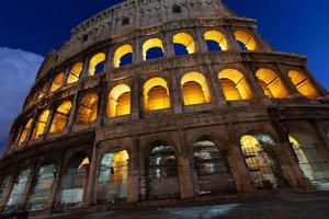 rome, italy, colosseum old ancient building gladiator battle at night. photo