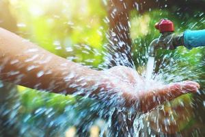 concept of good water management Makes it possible to have clean water to use forever. The hand that supports the water with happiness photo