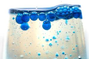blue bubbles in the glass of water.Blue tone,Abstract Backgrounds photo
