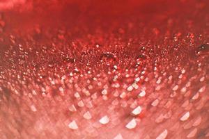 abstract red background with bokeh and  drops of water photo