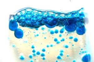 blue bubbles in the glass of water.Blue tone,Abstract Backgrounds photo