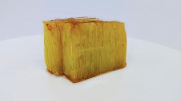 Bika ambon or golden cake or golden kuih bingka in Singapore, is an Indonesian dessert and authentic traditional food from asia. photo