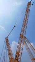 Top boom of crawler crane rise to the sky. photo