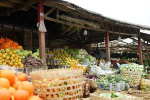 traditional fruit shop with all kinds of variety in the basket. fruit market background photo