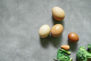 Fresh eggs are suitable for advertising on a concrete background photo
