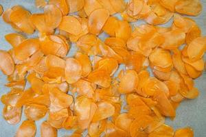 Raw yellow crackers ready to be cooked on a concrete background photo