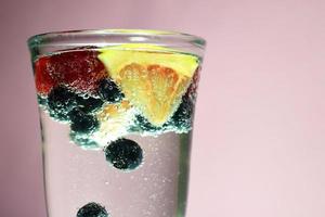 berries grapefruit and mineral water photo