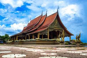 Sirindhorn Wararam Phu Prao Temple of Thailand, a unique image is a glow of the sculpture of the Kalpapruek, which is attached to the wall behind the church. It will appear green glow in the night. photo