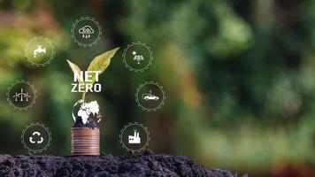 Net zero icon and carbon neutral concept in the hand for net zero greenhouse gas emissions target Climate neutral long term strategy on a green background. photo