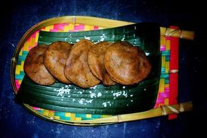 Asian Traditional Food Pakon Pitha. Location - Bogura, Bangladesh. Date - 24 November 2022 photo