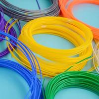 Plastic PLA and ABS filament material for printing on a 3D pen or printer of various colors photo