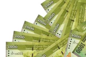 1000 Sri Lankan rupees bills lies in different order isolated on white. Local banking or money making concept photo