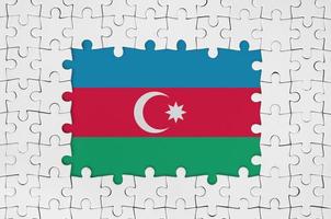 Azerbaijan flag in frame of white puzzle pieces with missing central part photo