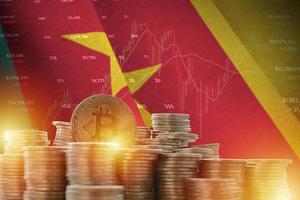 Cameroon flag and big amount of golden bitcoin coins and trading platform chart. Crypto currency photo