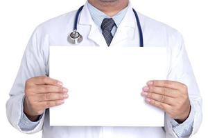 A male doctor with a white paper There is room for writing a message. White background. Concept of medical services. Copy space photo