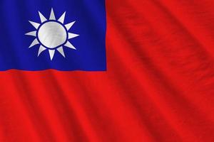 Taiwan flag with big folds waving close up under the studio light indoors. The official symbols and colors in banner photo