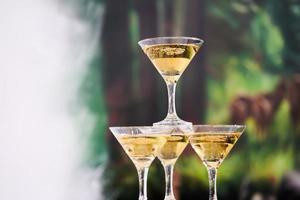 champagne glasses are arranged in a pyramid photo