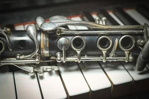 Clarinet on piano keyboard photo