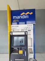 Jakarta, Indonesia in July 2022. This is a photo of an Automated Teller Machine or ATM from Bank Mandiri.