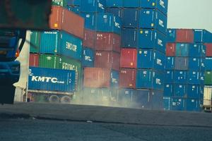 jakarta, Indonesia in October 2022. Stacks of containers of various colors are in an export-import warehouse. photo