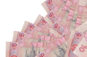 10 Ukrainian hryvnias bills lies in different order isolated on white. Local banking or money making concept photo