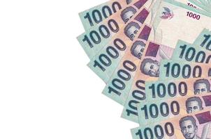 1000 Indonesian rupiah bills lies isolated on white background with copy space. Rich life conceptual background photo