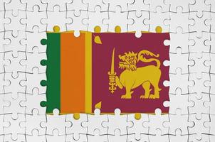 Sri Lanka flag in frame of white puzzle pieces with missing central part photo