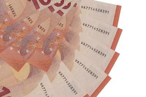 10 euro bills lies isolated on white background with copy space stacked in fan shape close up photo