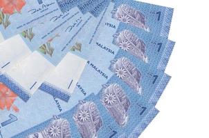 1 Malaysian ringgit bills lies isolated on white background with copy space stacked in fan shape close up photo