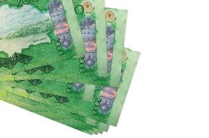 2000 Kazakhstani tenge bills lies in small bunch or pack isolated on white. Mockup with copy space. Business and currency exchange photo