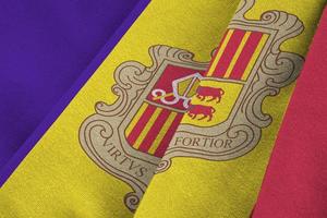 Andorra flag with big folds waving close up under the studio light indoors. The official symbols and colors in banner photo