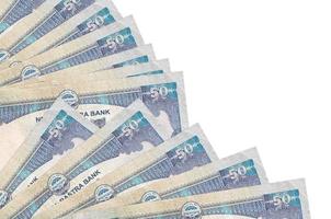 Los billetes de 50 rupias nepalíes se encuentran aislados en fondo blanco con espacio de copia apilado en el ventilador de cerca foto
