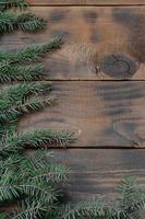 Tree branch on rustic wooden background used for christmas decoration photo