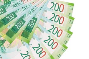 200 russian rubles bills lies isolated on white background with copy space stacked in fan shape close up photo