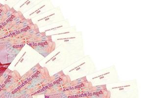 500 Cambodian riels bills lies isolated on white background with copy space stacked in fan close up photo