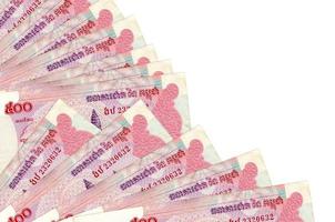 500 Cambodian riels bills lies isolated on white background with copy space stacked in fan close up photo