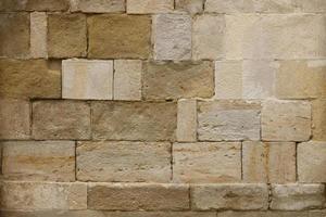 Texture of stone wall with many big brown stones photo