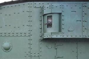 Abstract green industrial metal textured background with rivets and bolts photo