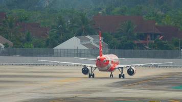 PHUKET, THAILAND DECEMBER 2, 2016 - AirAsia Airbus 320 HS BBS taxiing after landing. View from the top floor of the hotel Centara Grand West Sands Resort Phuket video