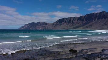 Panorama of the empty road through sandy and volcanic desert video