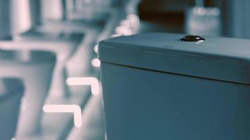 Rotating washbasin. Studio filming. In the background a row of toilets. 4k video