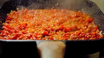 Fried eggs in Georgian cuisine, chirbuli. Eggs with tomatoes steaming in the pan video