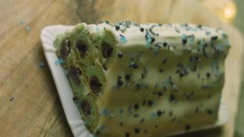 Cake with green dough, sour cherries and sour cream. It also has food ornament and the red star cake video